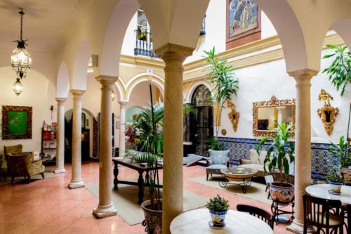 yellow tiled lobby with marble columns