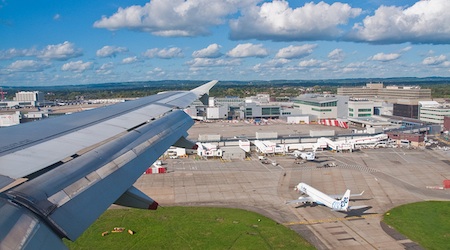 plane flying above Gatwick Airport