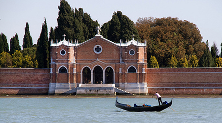 person boating past gates of Isola di San Michele